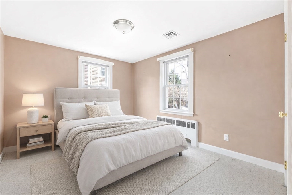 51 Stockdale Road Needham, MA 02492 - Photo 7 of 21 a bedroom with a bed and a window