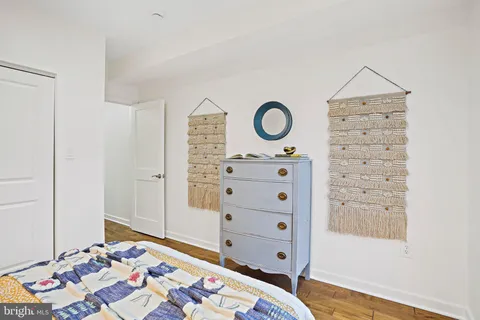 a bedroom with a bed and a dresser