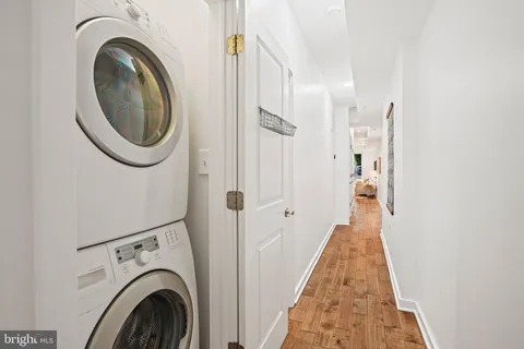a view of a hallway with washer and dryer