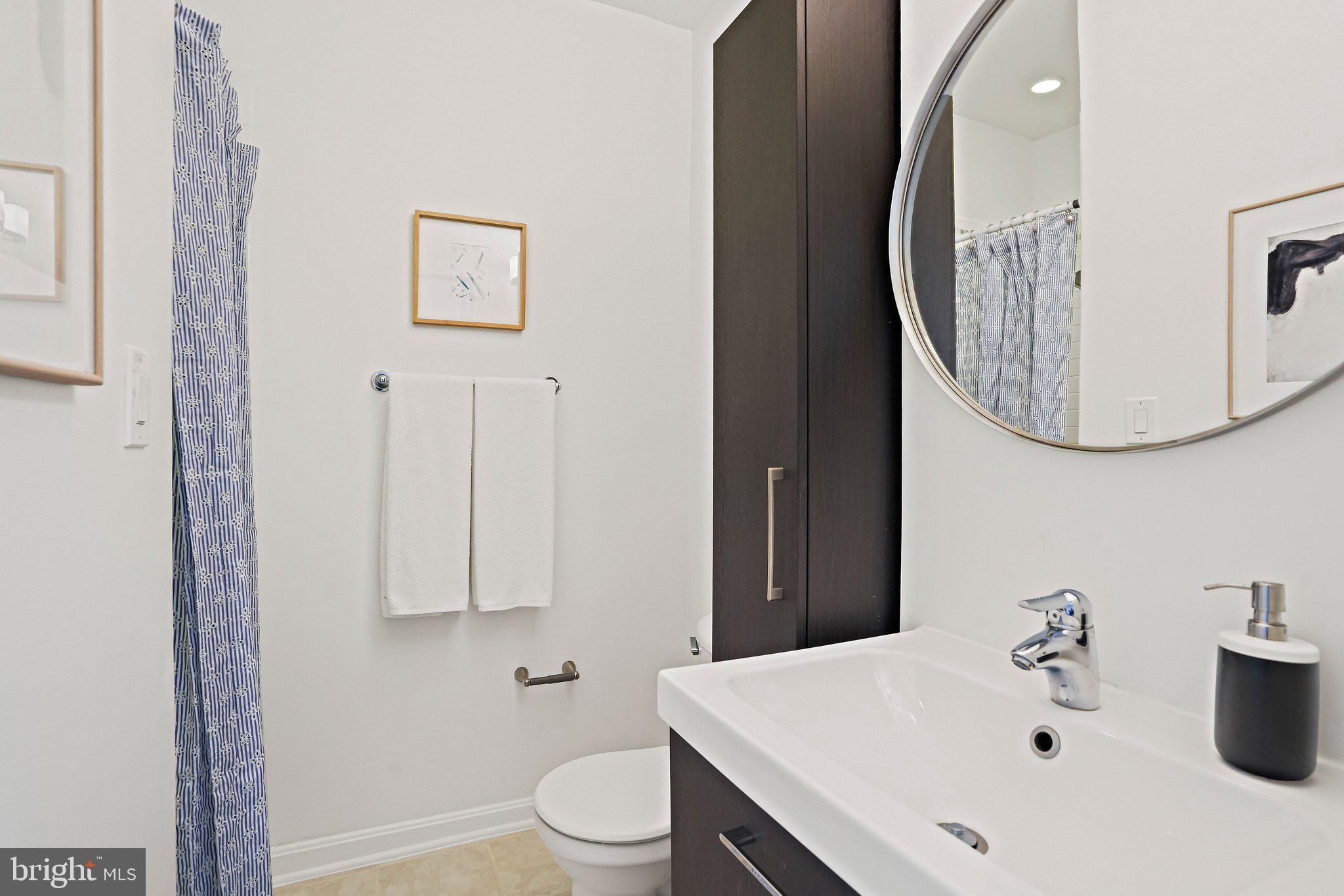1921 2nd Street Northeast, Unit 102 Washington, DC 20002 - Photo 7 of 19 Hall bath with stand-up shower