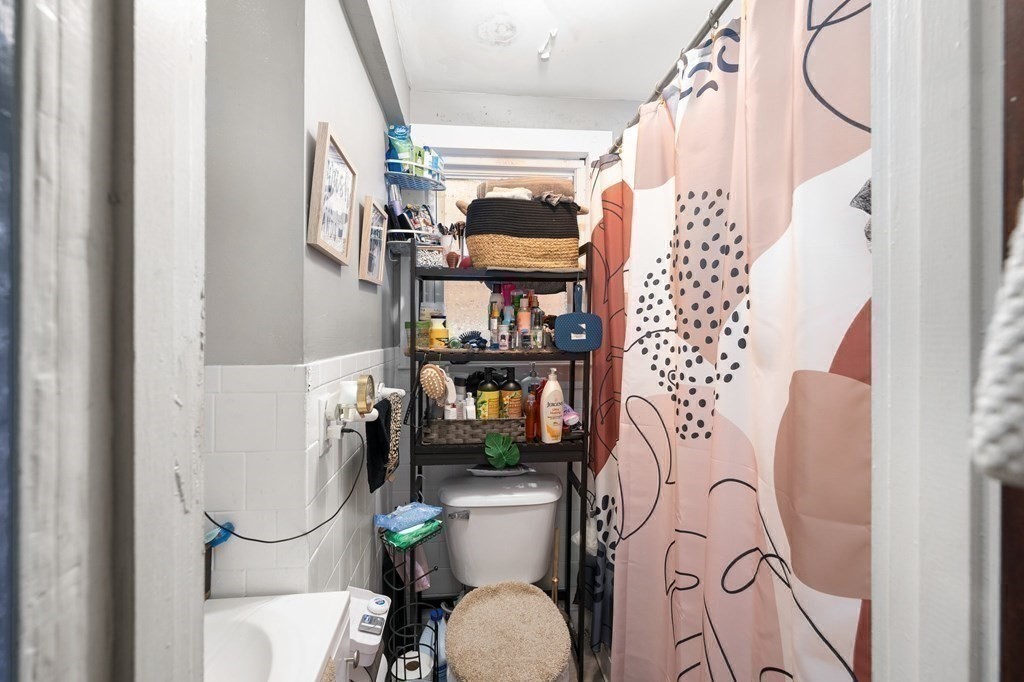 152 Fountain Street Fall River, MA 02721 - Photo 14 of 27 a bathroom with a sink toilet and shower