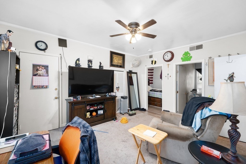 152 Fountain Street Fall River, MA 02721 - Photo 17 of 27 a living room with furniture and a flat screen tv