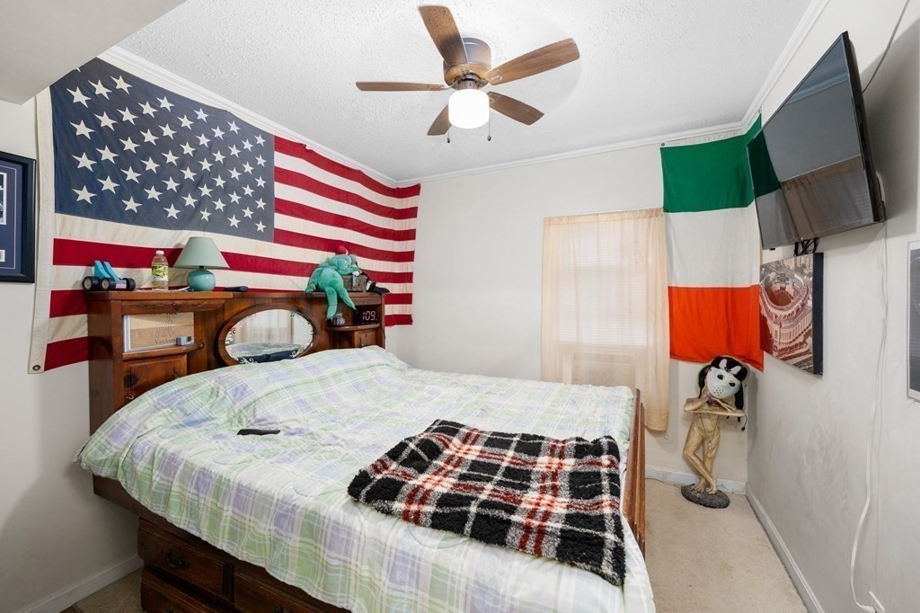 152 Fountain Street Fall River, MA 02721 - Photo 20 of 27 a bedroom with a bed and a flat screen tv