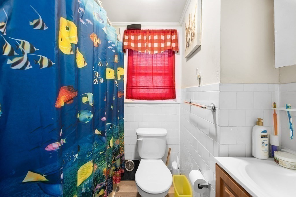 152 Fountain Street Fall River, MA 02721 - Photo 23 of 27 a bathroom with a toilet sink and mirror