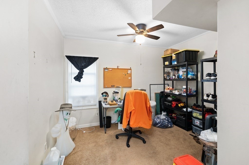 152 Fountain Street Fall River, MA 02721 - Photo 4 of 27 a view of a workspace with furniture and a window