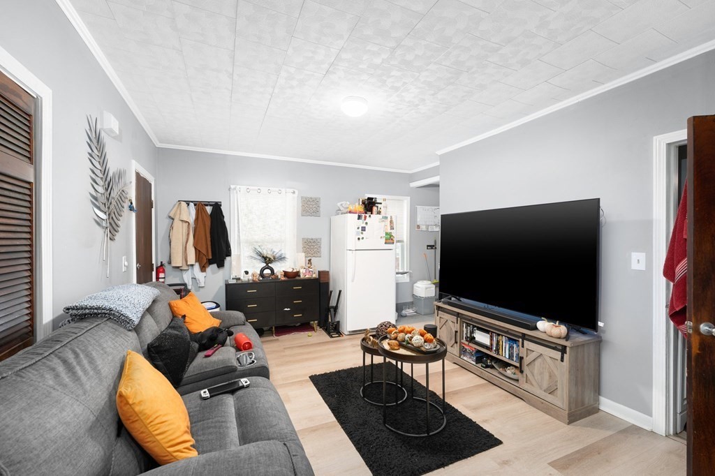 152 Fountain Street Fall River, MA 02721 - Photo 7 of 27 a living room with furniture and a flat screen tv