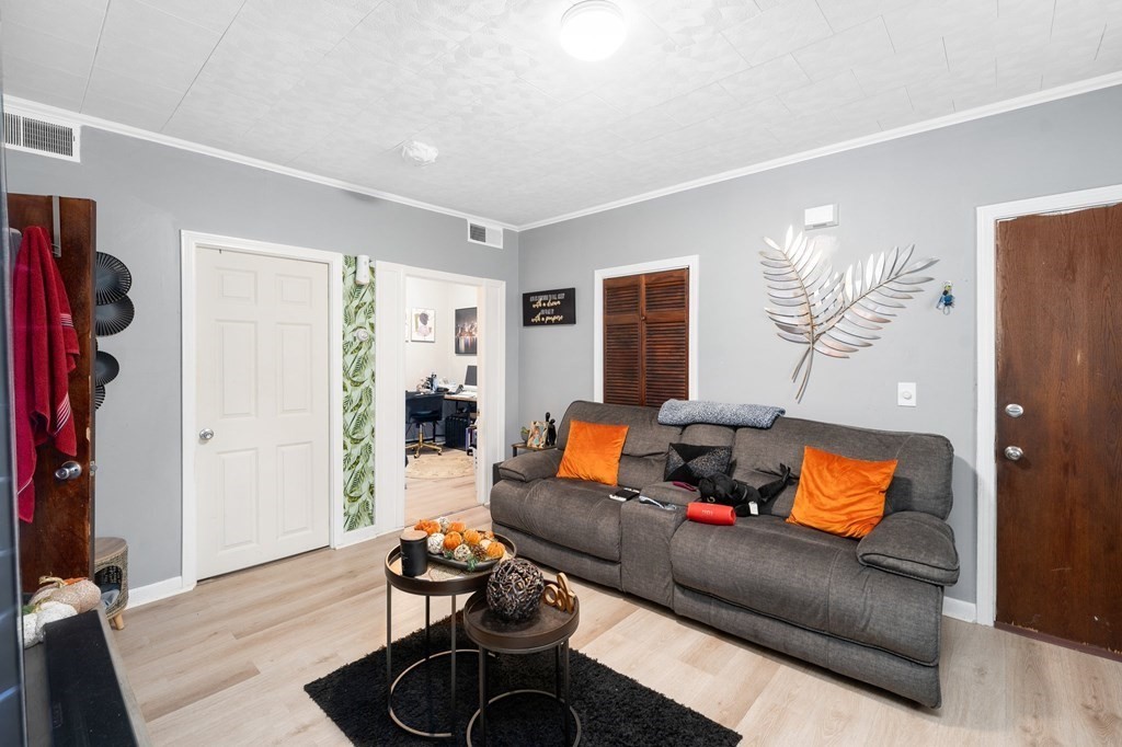 152 Fountain Street Fall River, MA 02721 - Photo 8 of 27 a living room with furniture ceiling fan and a window