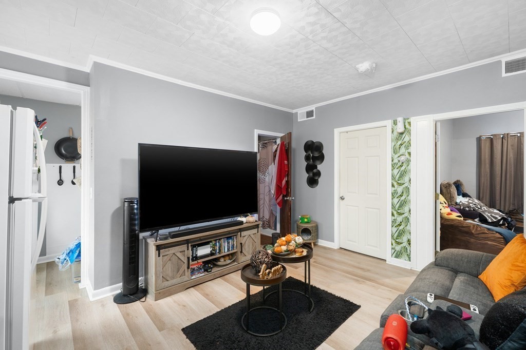 152 Fountain Street Fall River, MA 02721 - Photo 9 of 27 a living room with furniture and a flat screen tv