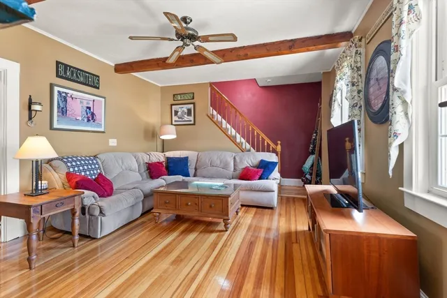 a living room with furniture and a rug