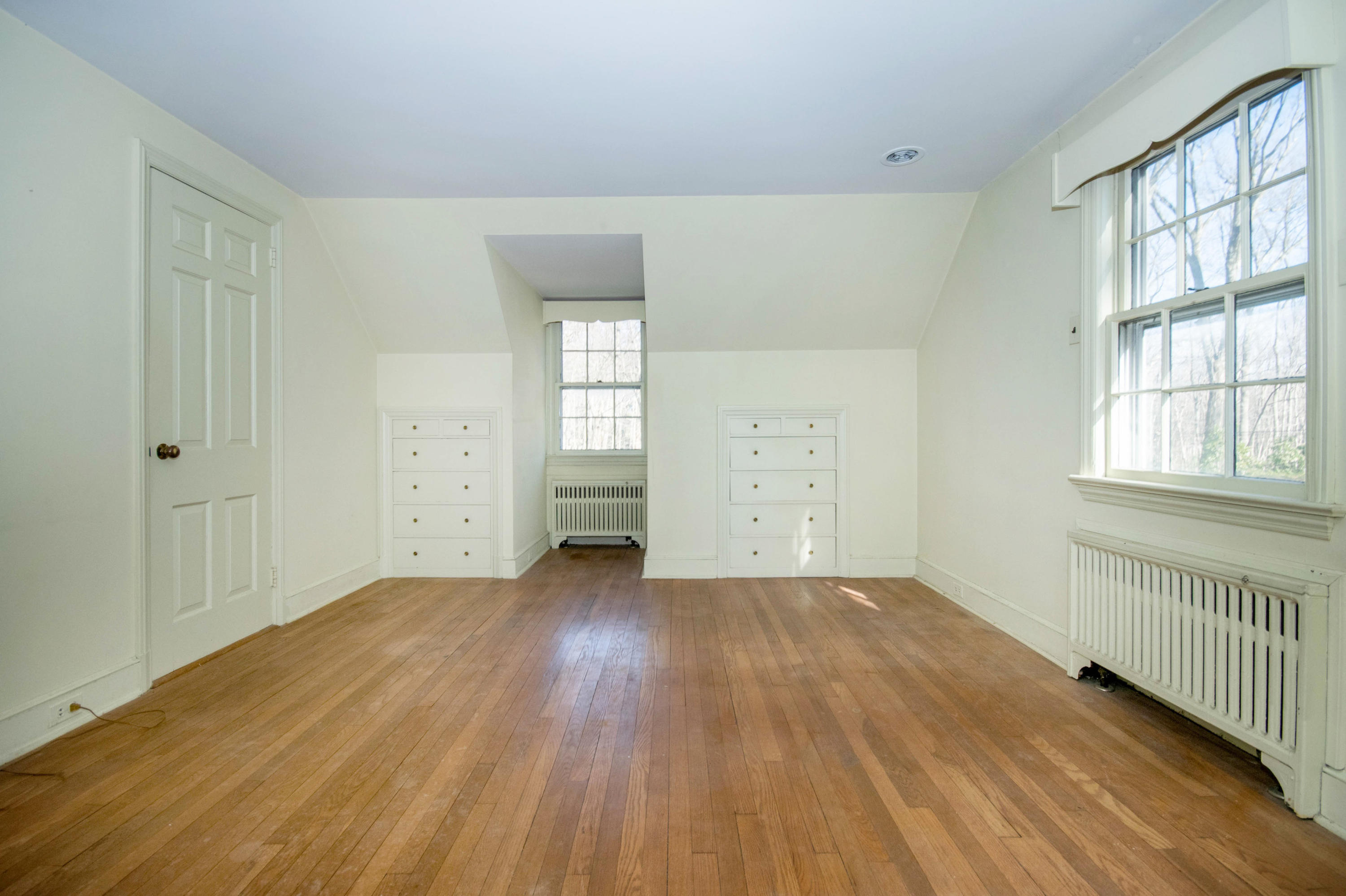 792 Smith Ridge Road New Canaan, CT 06840 - Photo 15 of 18 wooden floor in an empty room with a window