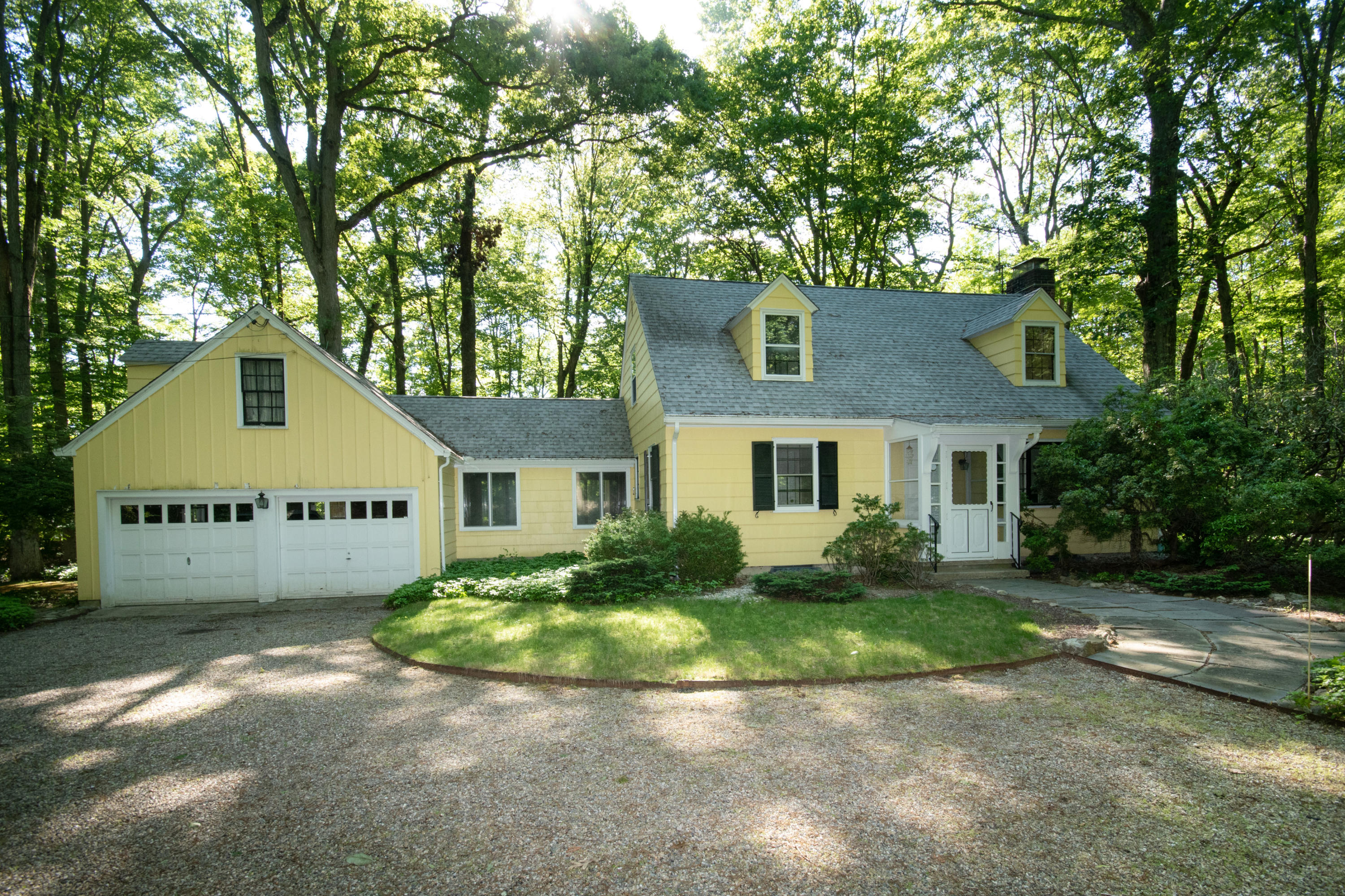 792 Smith Ridge Road New Canaan, CT 06840 - Photo 2 of 18 front view of house with a yard