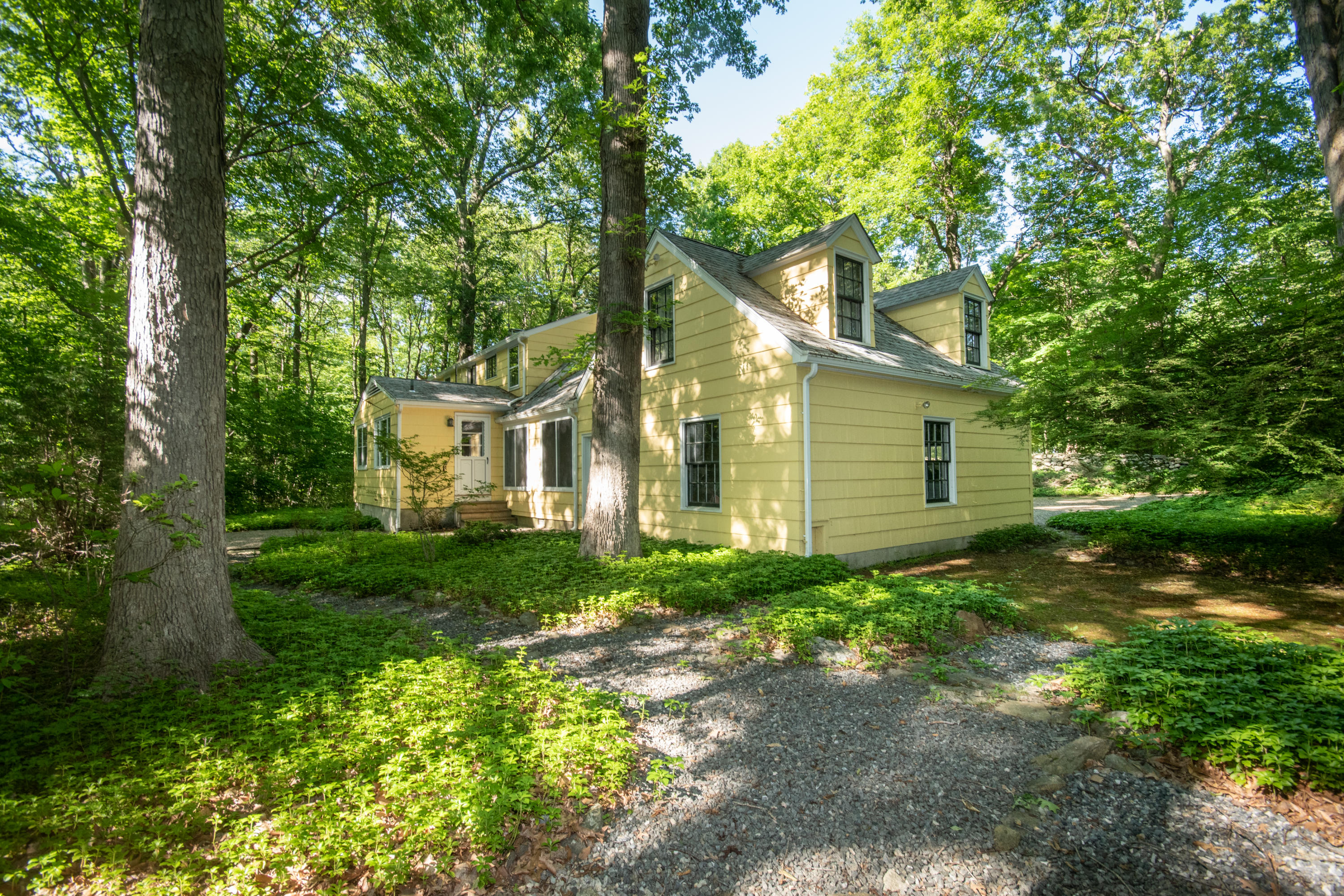 792 Smith Ridge Road New Canaan, CT 06840 - Photo 3 of 18 a view of a house with a yard