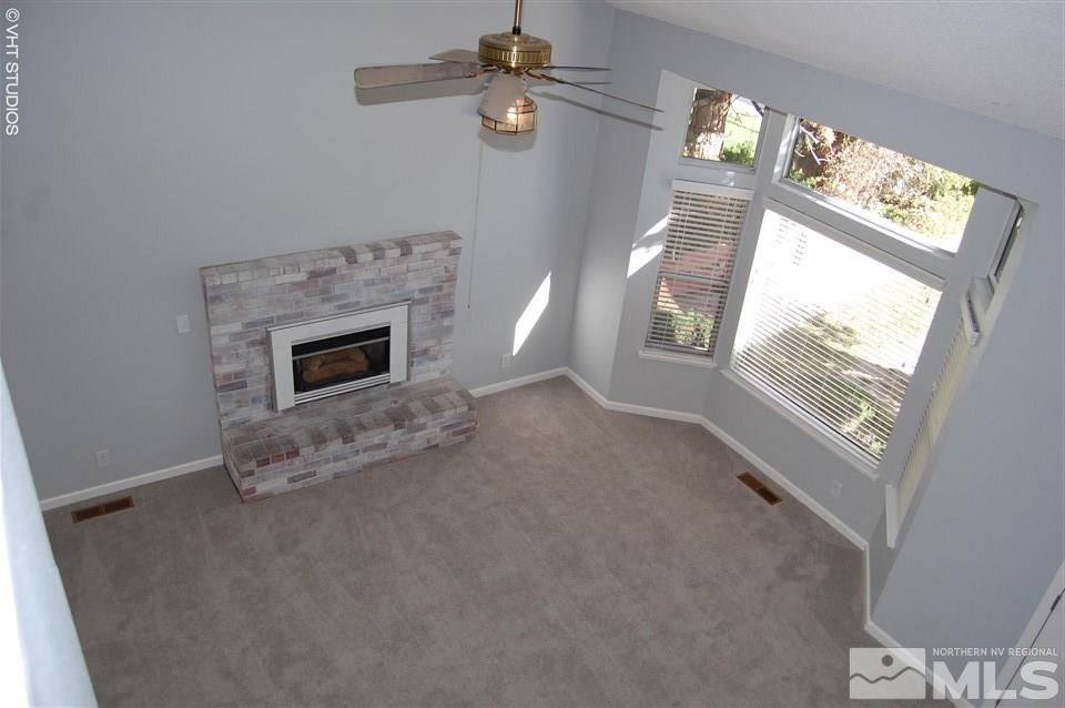 1645 Peavine Road Reno, NV 89503 - Photo 6 of 25 en empty room with windows and fireplace
