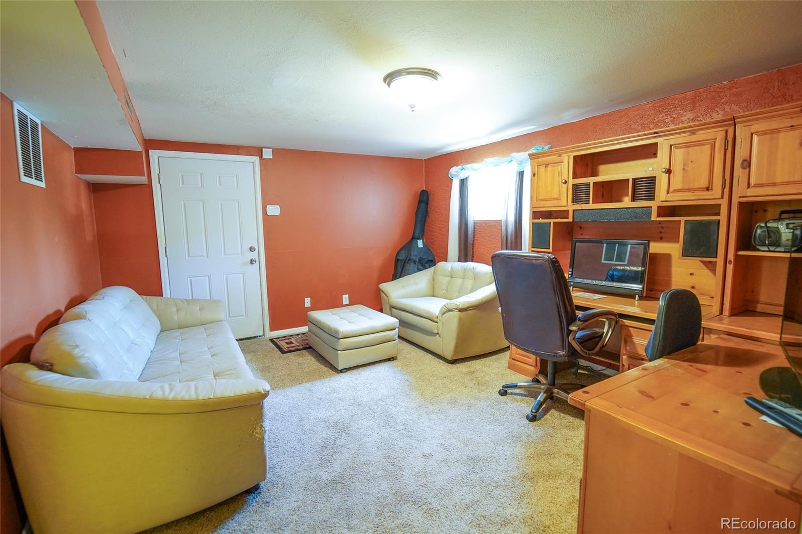 806 Paradise Lane Colorado Springs, CO 80904 - Photo 15 of 45 a living room with furniture and a window
