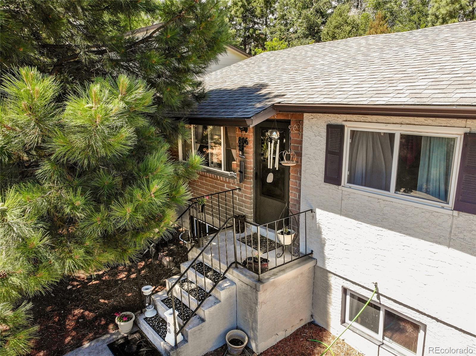 806 Paradise Lane Colorado Springs, CO 80904 - Photo 16 of 45 a view of house with backyard
