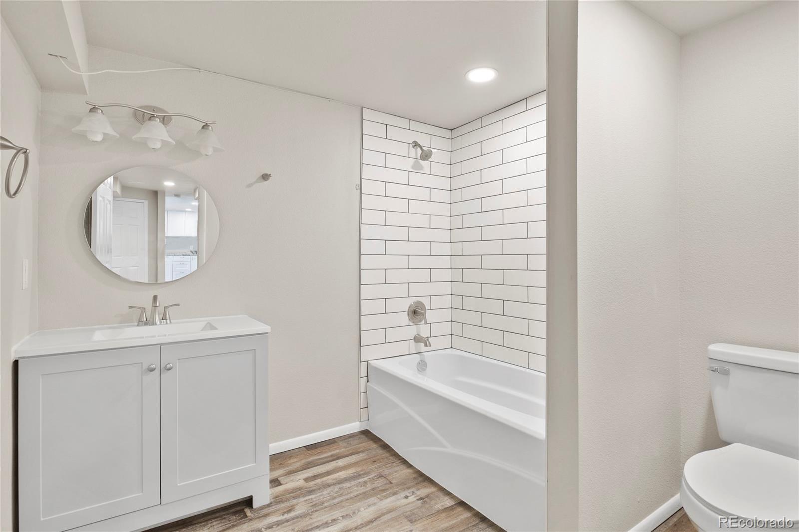 806 Paradise Lane Colorado Springs, CO 80904 - Photo 25 of 45 a bathroom with a sink a toilet and shower