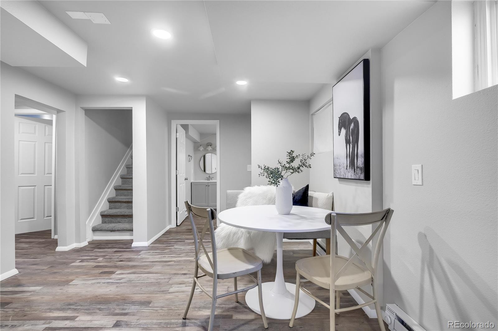 806 Paradise Lane Colorado Springs, CO 80904 - Photo 27 of 45 a view of a dining room with furniture and wooden floor