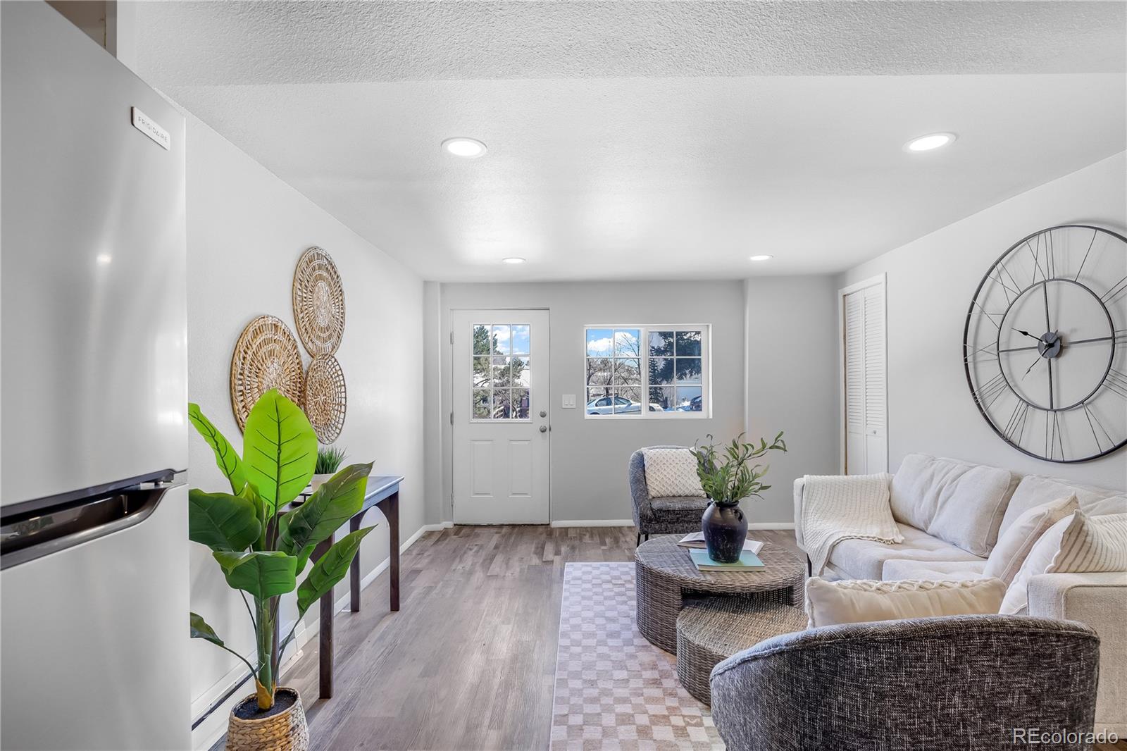 806 Paradise Lane Colorado Springs, CO 80904 - Photo 33 of 45 a living room with furniture a rug and a potted plant