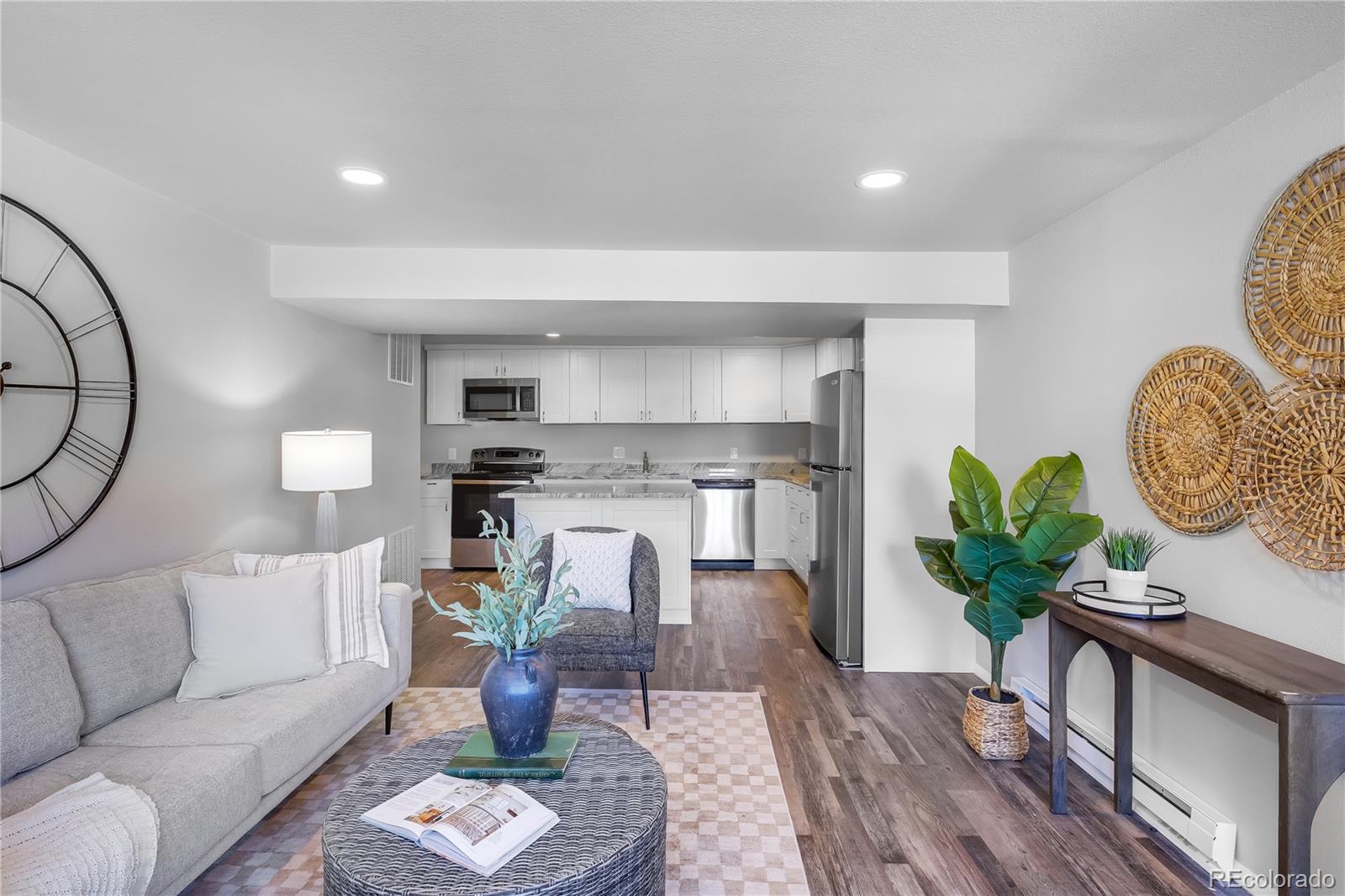 806 Paradise Lane Colorado Springs, CO 80904 - Photo 39 of 45 a living room with furniture a chandelier and wooden floor