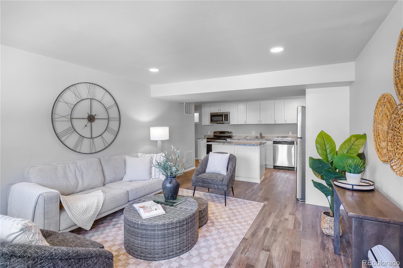 806 Paradise Lane Colorado Springs, CO 80904 - Photo 41 of 45 a living room with furniture a rug and a potted plant