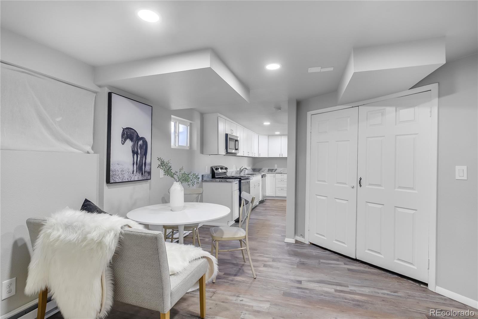806 Paradise Lane Colorado Springs, CO 80904 - Photo 42 of 45 a view of a dining room with furniture and wooden floor