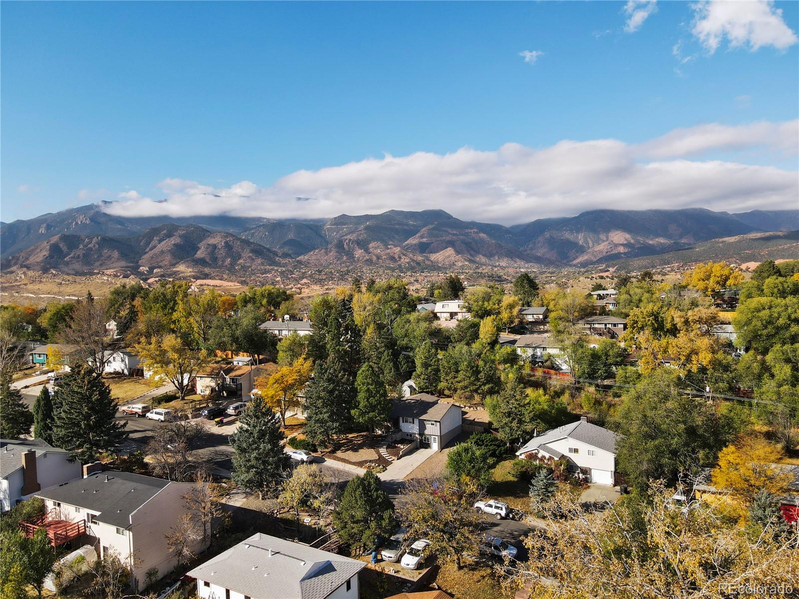 806 Paradise Lane Colorado Springs, CO 80904 - Photo 45 of 45 an aerial view of residential house with parking space and mountain view in back