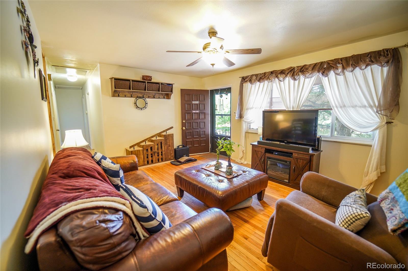 806 Paradise Lane Colorado Springs, CO 80904 - Photo 5 of 45 a bedroom with furniture and a flat screen tv