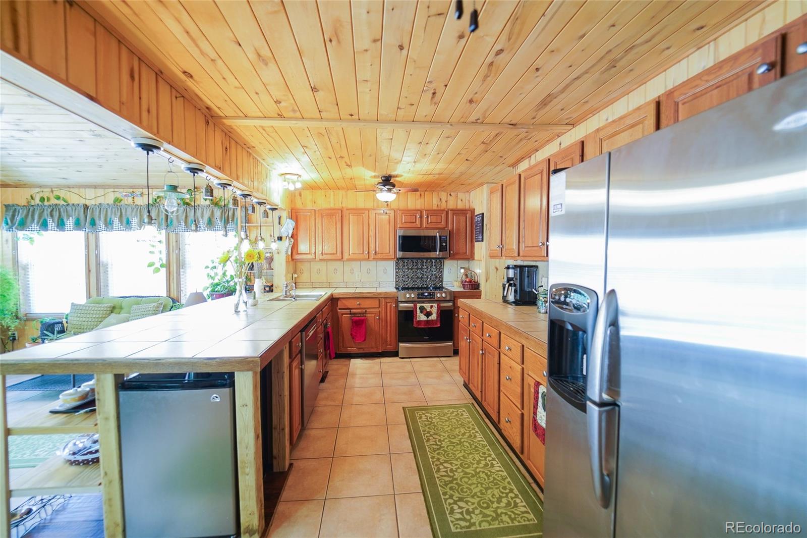 806 Paradise Lane Colorado Springs, CO 80904 - Photo 8 of 45 a kitchen with stainless steel appliances granite countertop a sink and cabinets