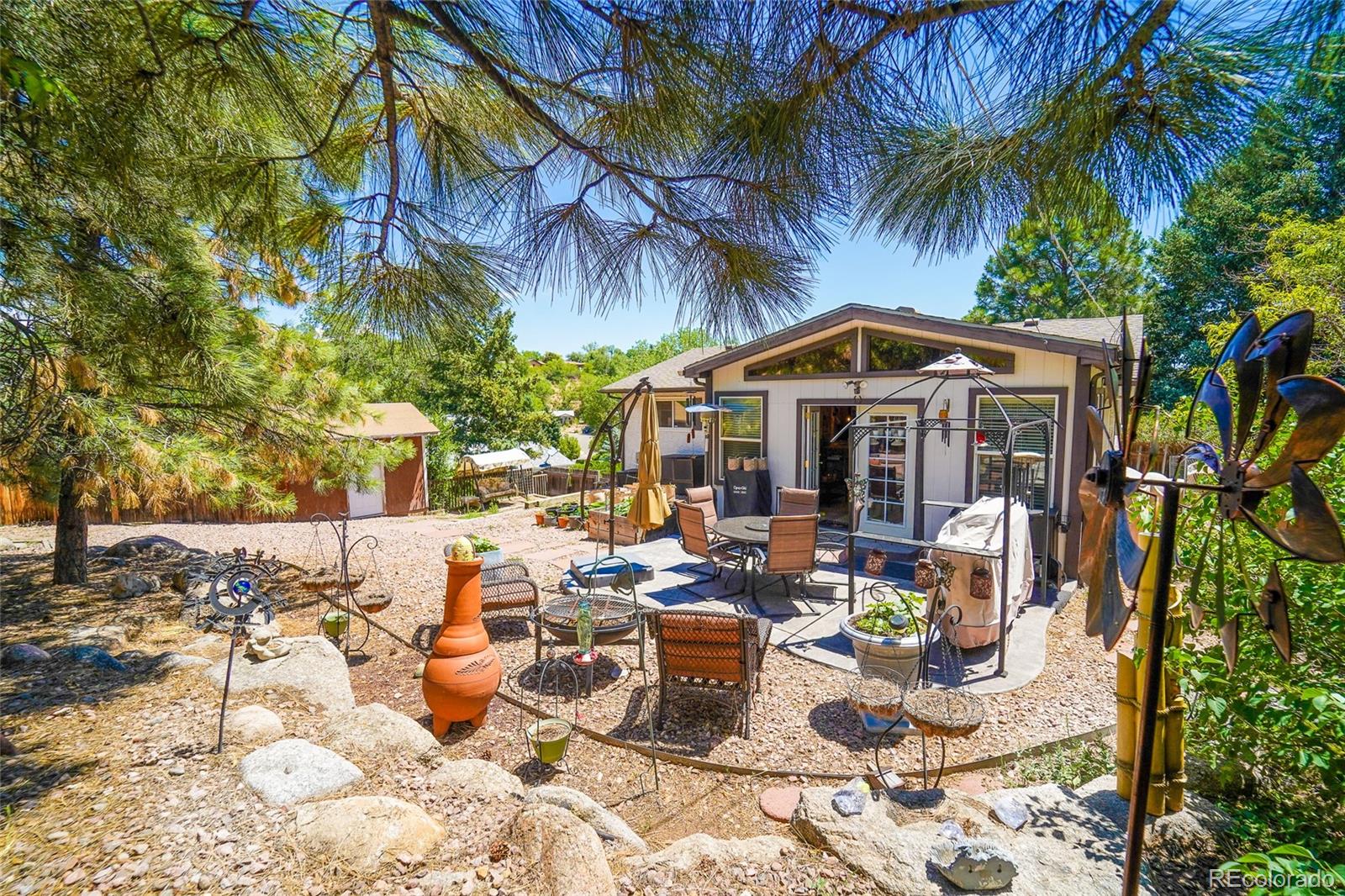 806 Paradise Lane Colorado Springs, CO 80904 - Photo 9 of 45 a view of a chair and tables in the patio