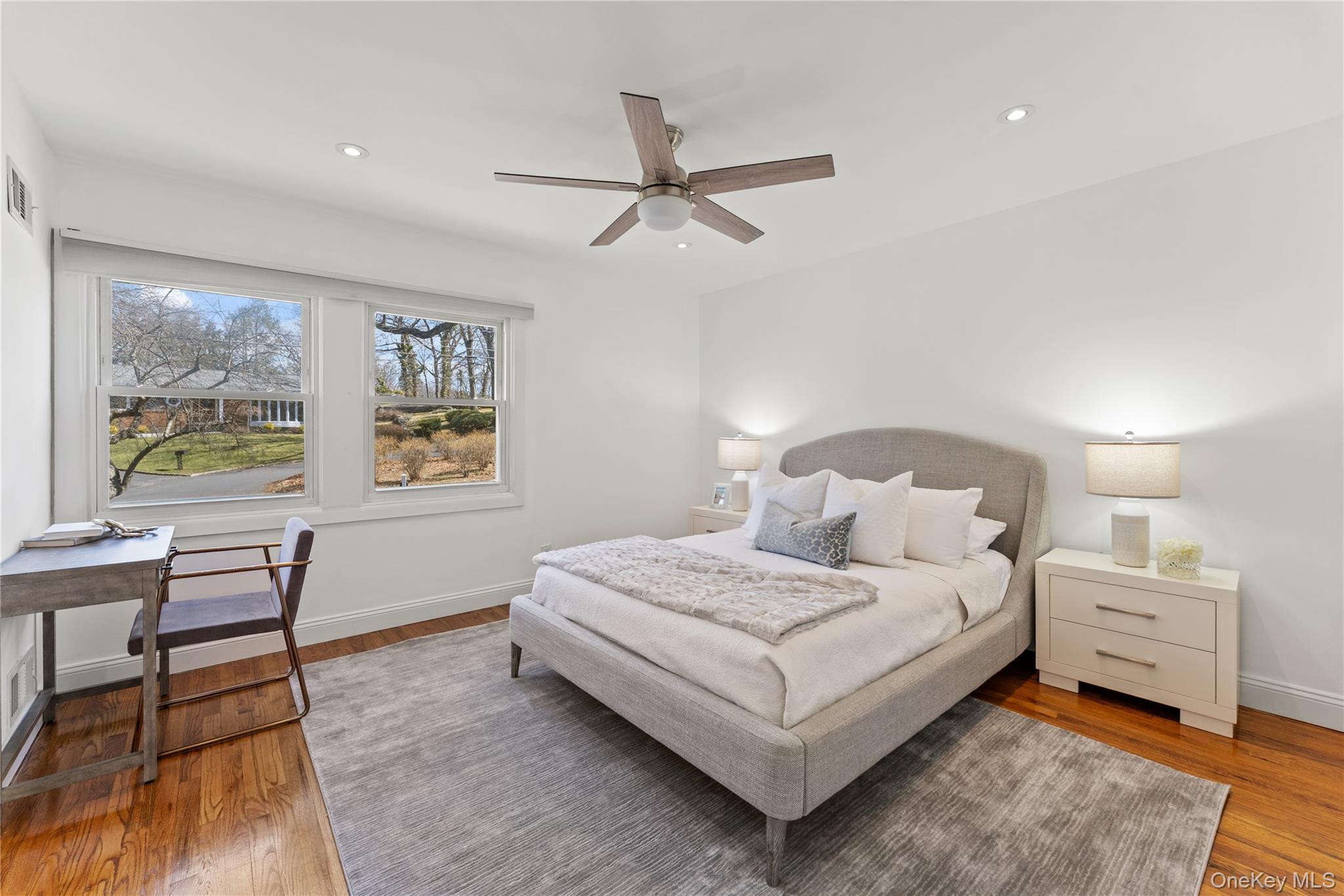 236 Robert Drive New Rochelle, NY 10804 - Photo 11 of 27 a bedroom with a bed and a table