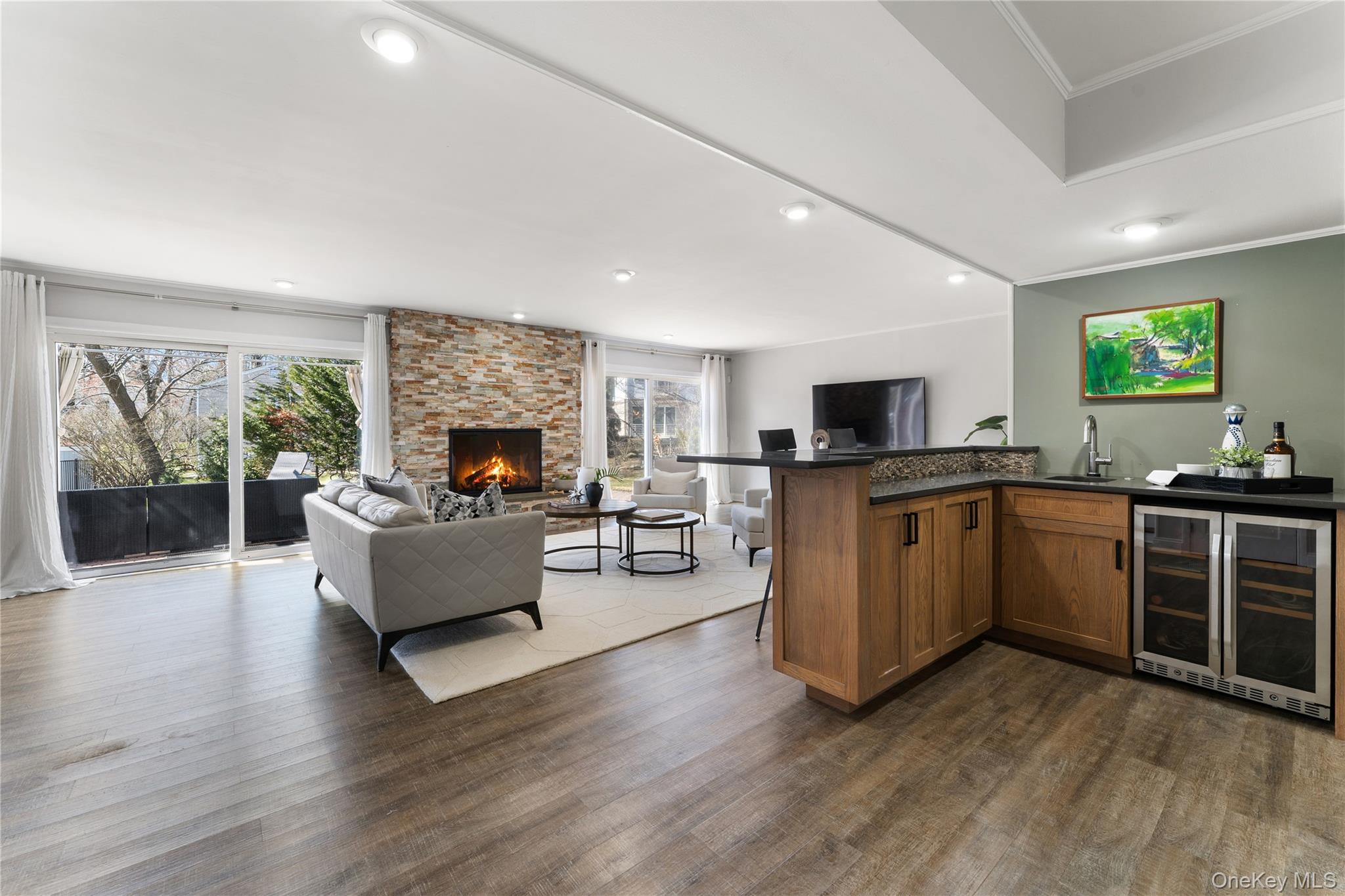 236 Robert Drive New Rochelle, NY 10804 - Photo 16 of 27 a living room with furniture wooden floor and a fireplace