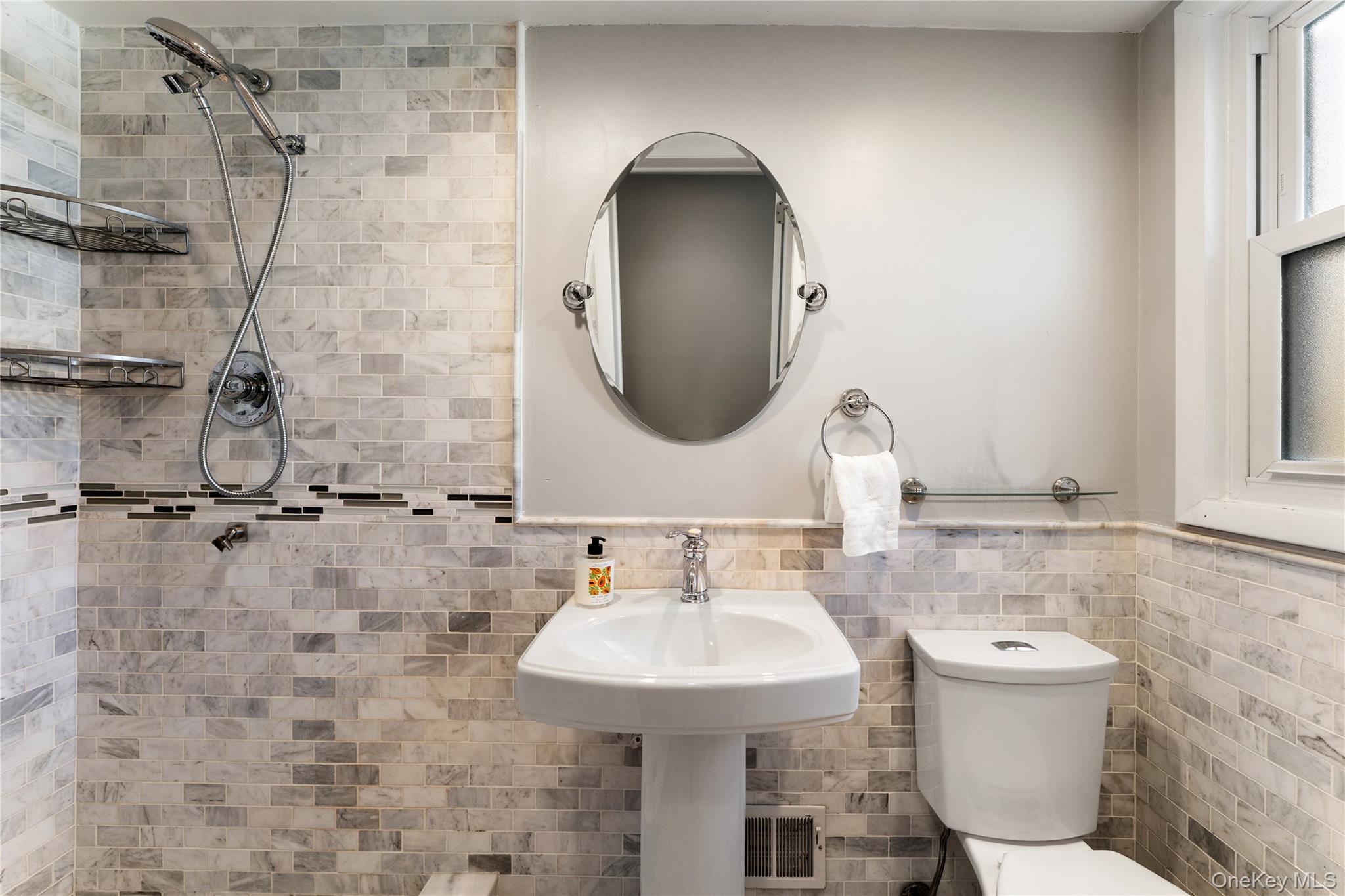 236 Robert Drive New Rochelle, NY 10804 - Photo 19 of 27 a bathroom with a sink toilet and a mirror