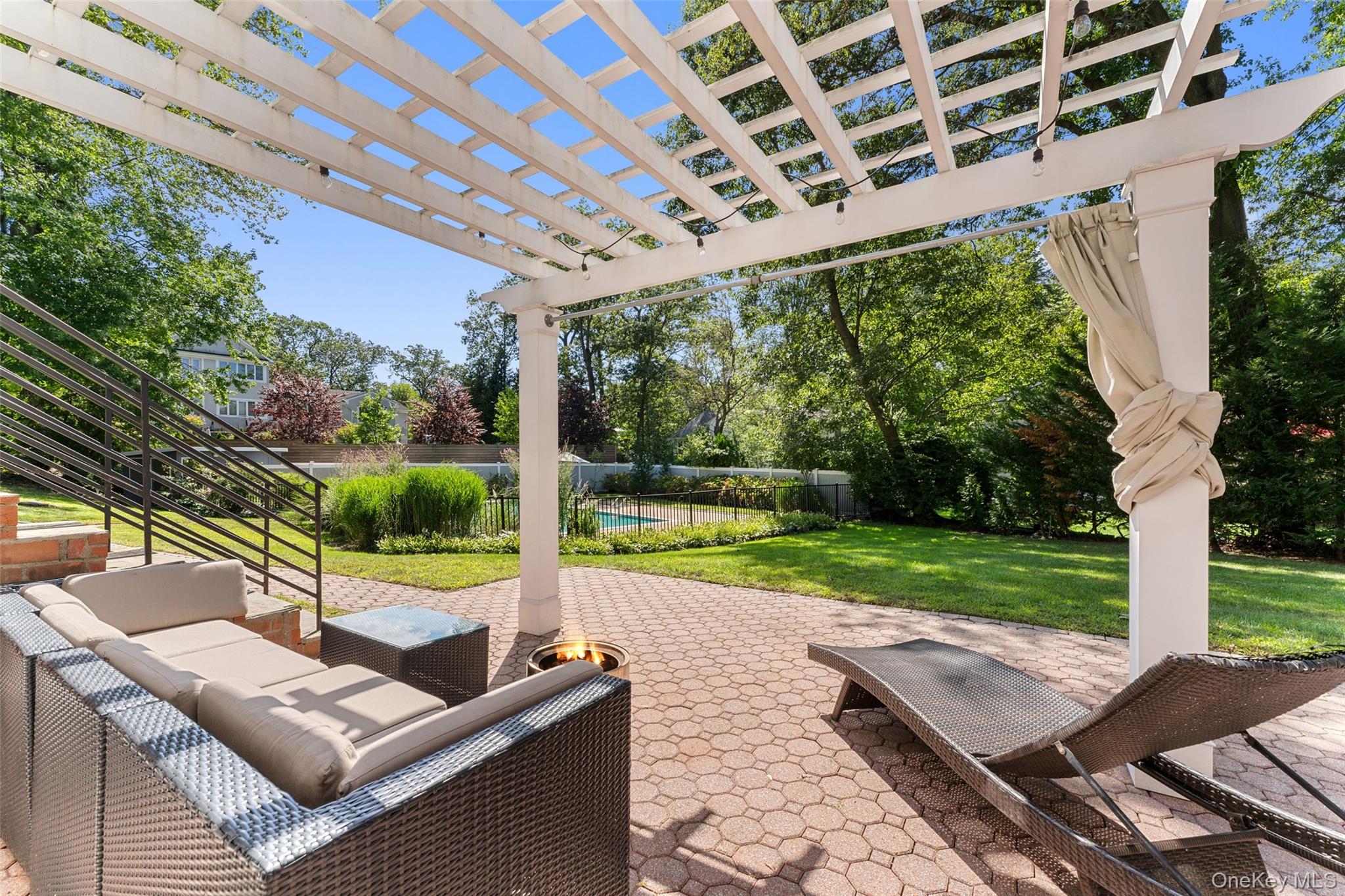 236 Robert Drive New Rochelle, NY 10804 - Photo 20 of 27 a view of a patio with chairs and a backyard