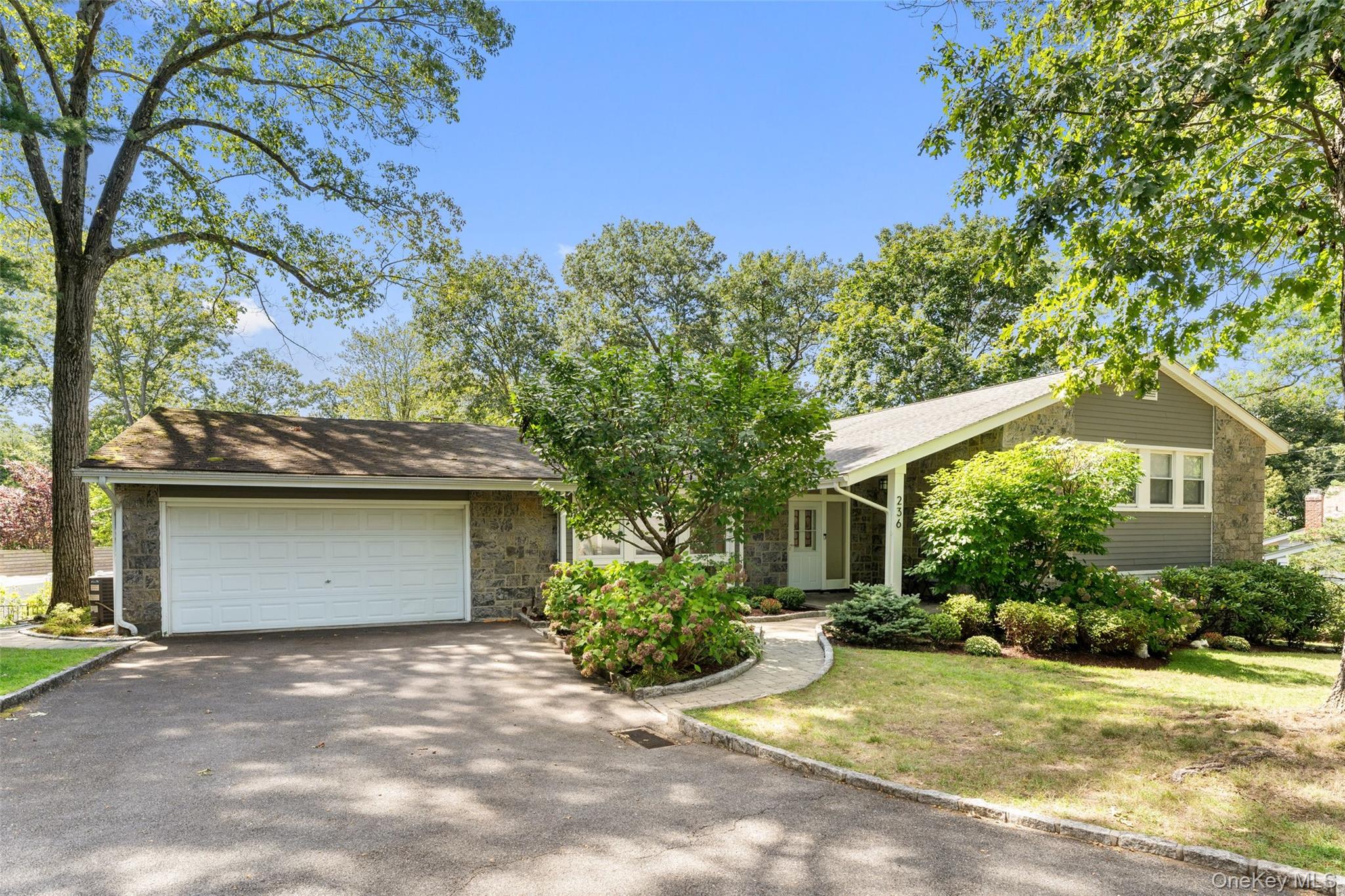 236 Robert Drive New Rochelle, NY 10804 - Photo 2 of 27 a view of a house with a yard and large tree