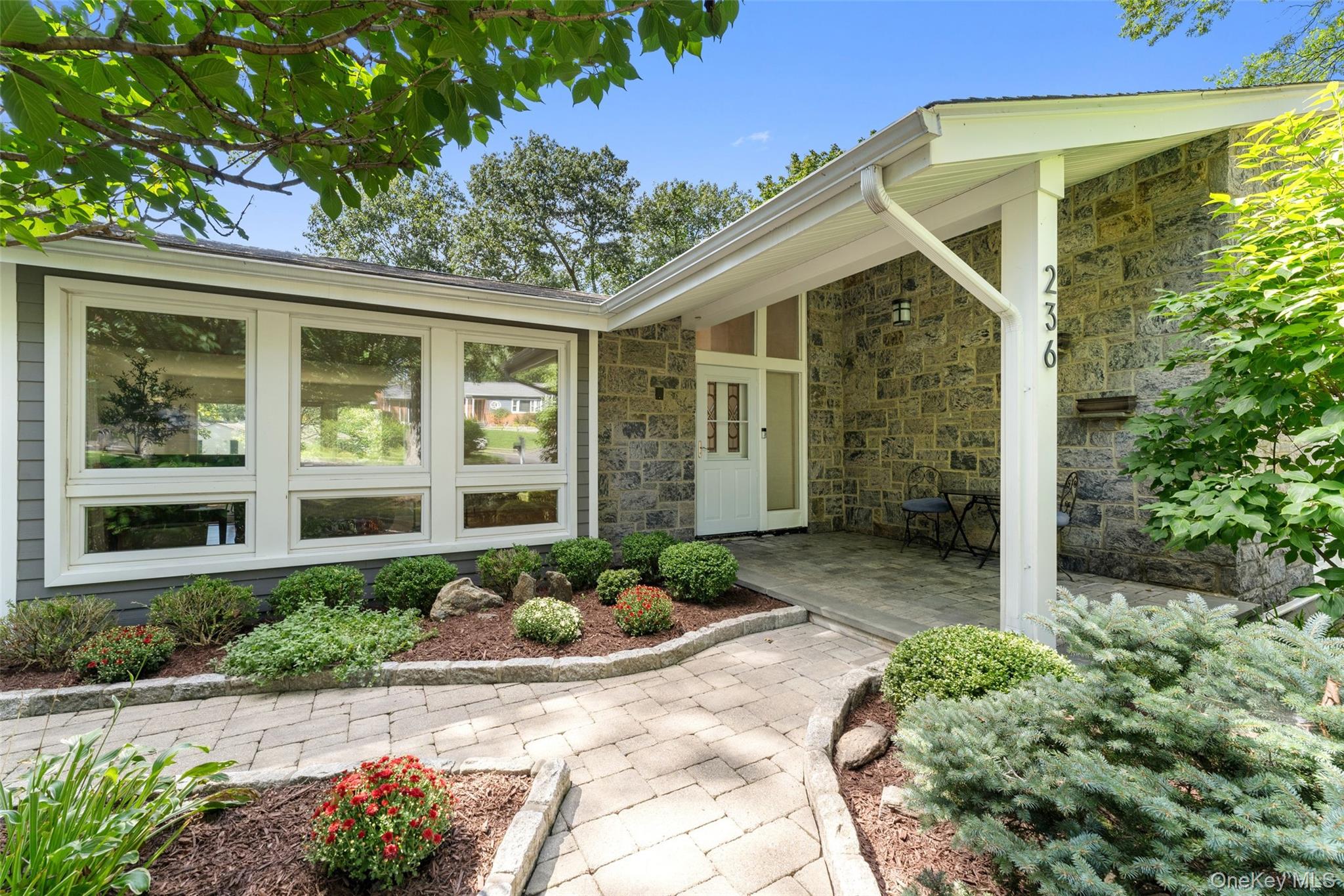 236 Robert Drive New Rochelle, NY 10804 - Photo 3 of 27 a front view of a house with garden