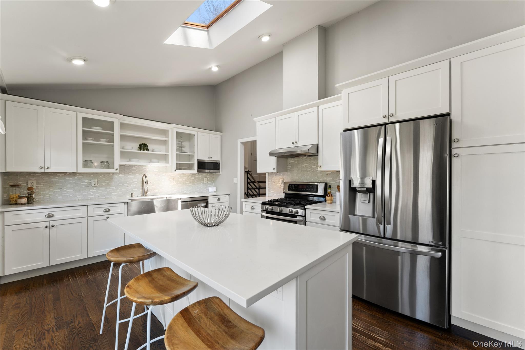 236 Robert Drive New Rochelle, NY 10804 - Photo 8 of 27 a kitchen with stainless steel appliances a refrigerator stove microwave and cabinets