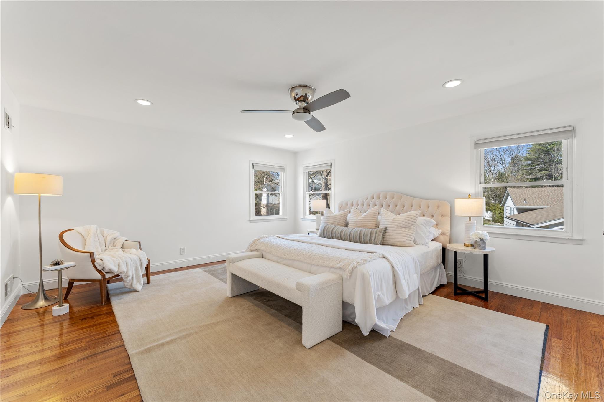 236 Robert Drive New Rochelle, NY 10804 - Photo 9 of 27 a bed room with a bed and a chair