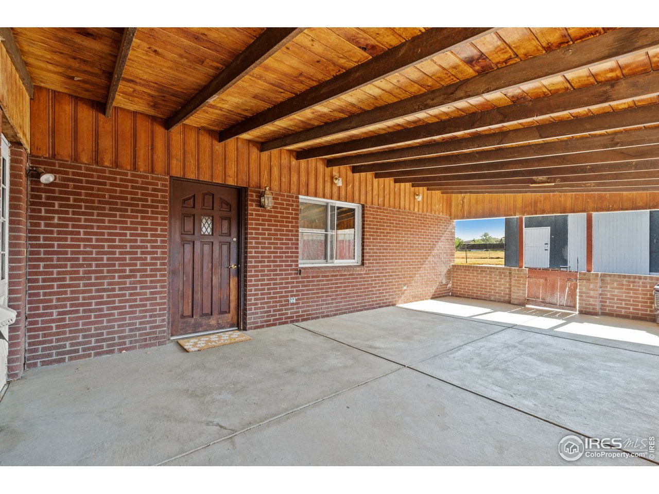 13844 Elmore Road Longmont, CO 80504 - Photo 24 of 34 Covered back patio