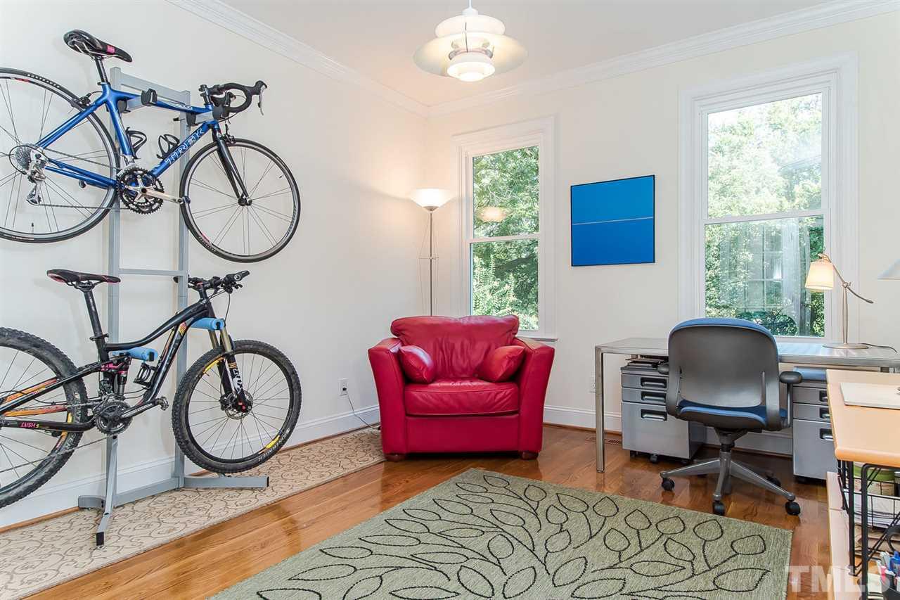 2712 Clark Avenue Raleigh, NC 27607 - Photo 11 of 24 a living room with furniture a window and gym equipment