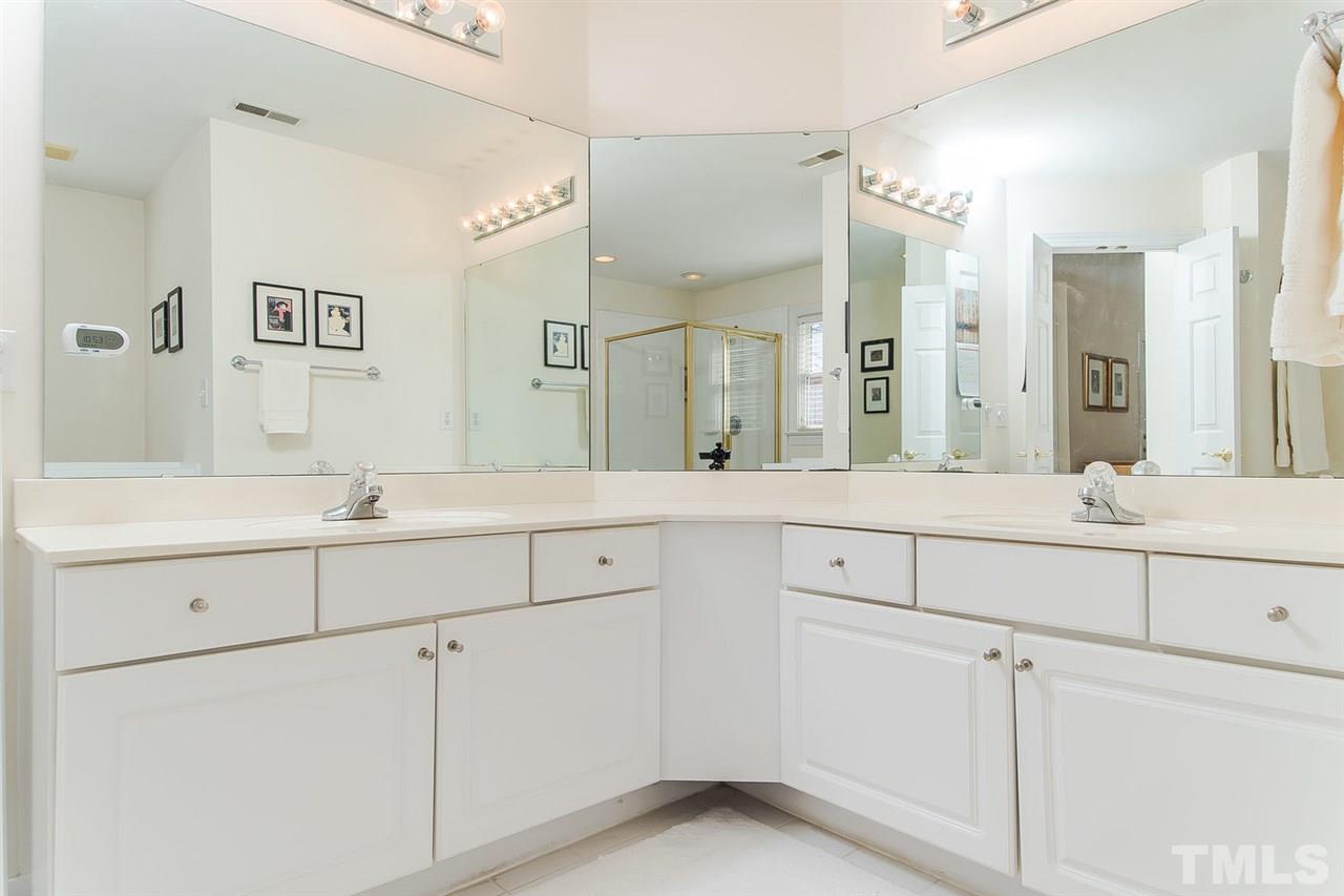 2712 Clark Avenue Raleigh, NC 27607 - Photo 16 of 24 a bathroom with a sink and a mirror