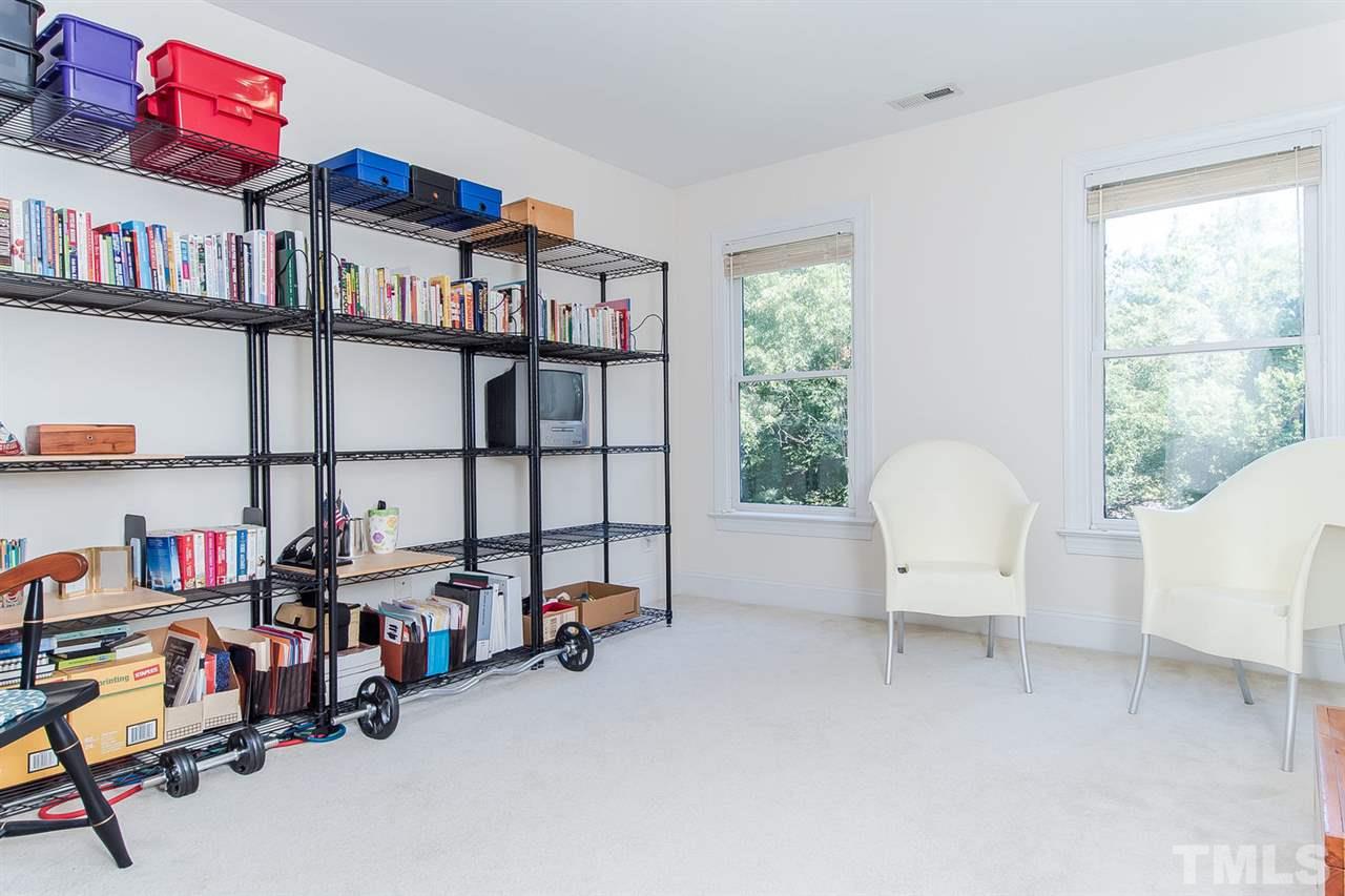 2712 Clark Avenue Raleigh, NC 27607 - Photo 18 of 24 a view of a workspace with furniture and a window