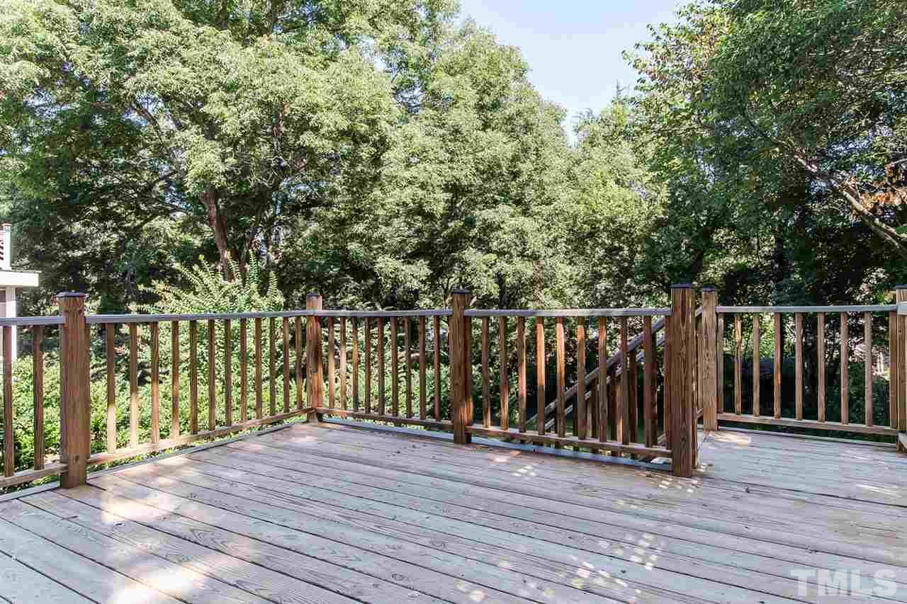 2712 Clark Avenue Raleigh, NC 27607 - Photo 21 of 24 a view of deck with wooden floor and fence