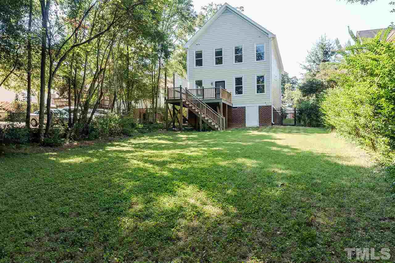 2712 Clark Avenue Raleigh, NC 27607 - Photo 24 of 24 a view of a house with a big yard and large trees