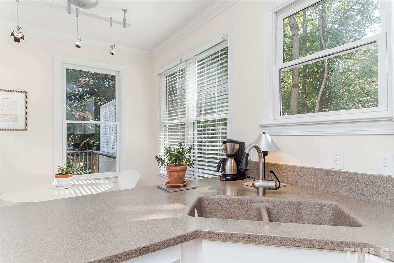 2712 Clark Avenue Raleigh, NC 27607 - Photo 9 of 24 a kitchen with a sink and a window