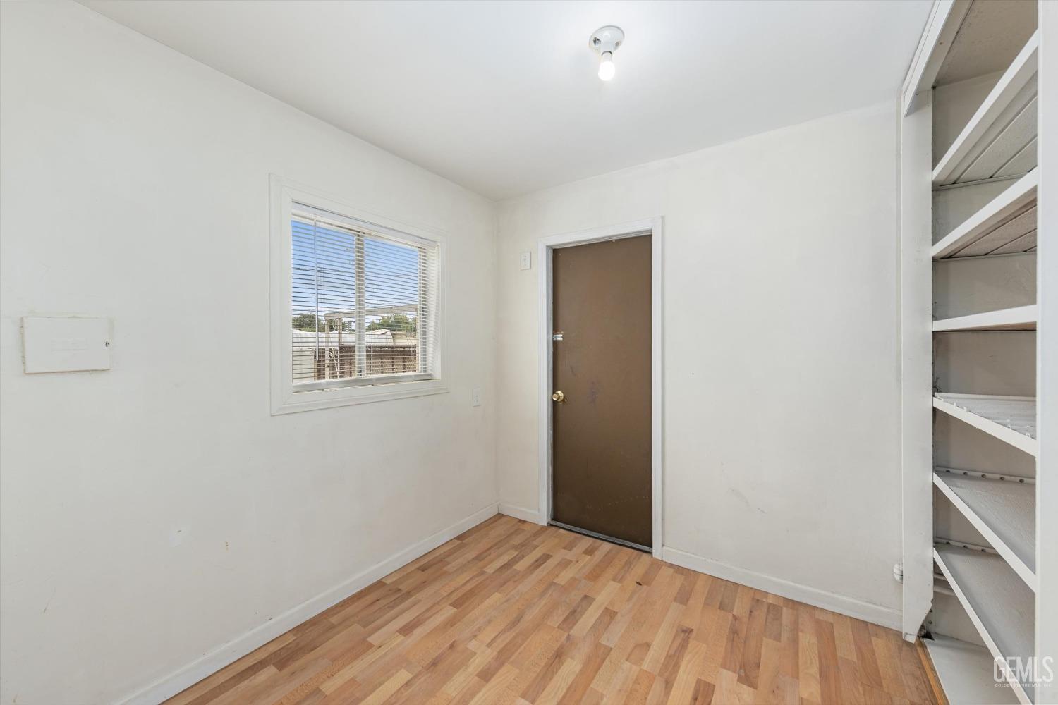 Undisclosed Address Bakersfield, CA 93308 - Photo 14 of 32 a view of a room with wooden floor and closet