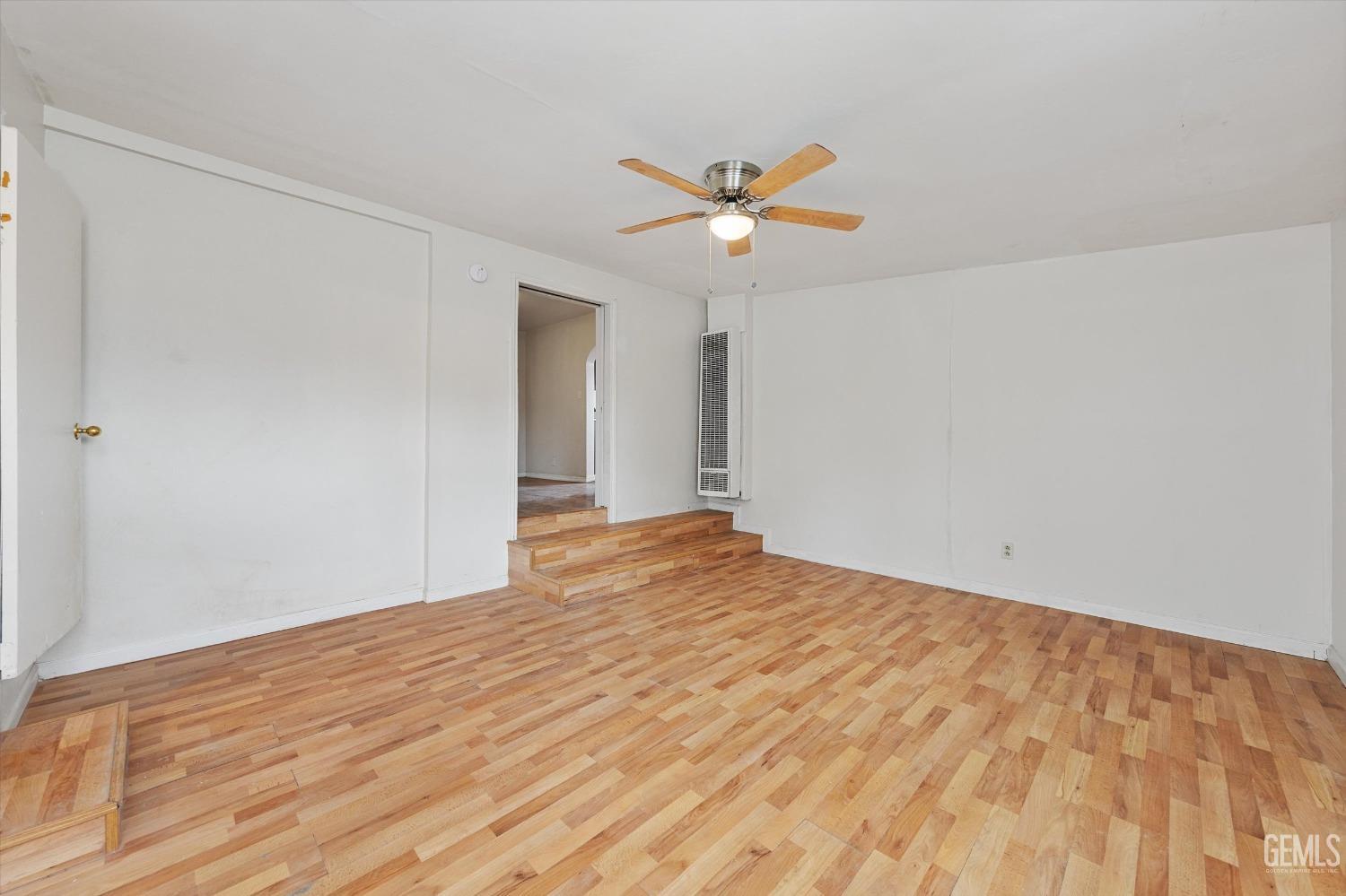 Undisclosed Address Bakersfield, CA 93308 - Photo 16 of 32 a view of a big room with wooden floor and closet in a room