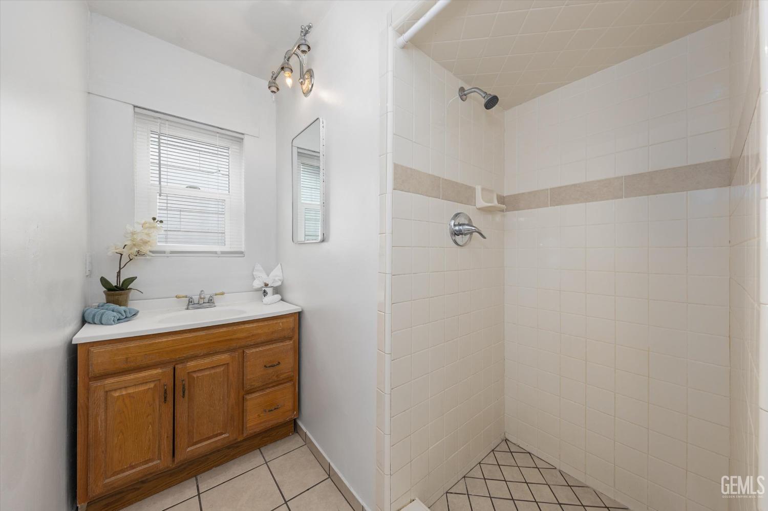 Undisclosed Address Bakersfield, CA 93308 - Photo 23 of 32 a bathroom with a sink a toilet and shower