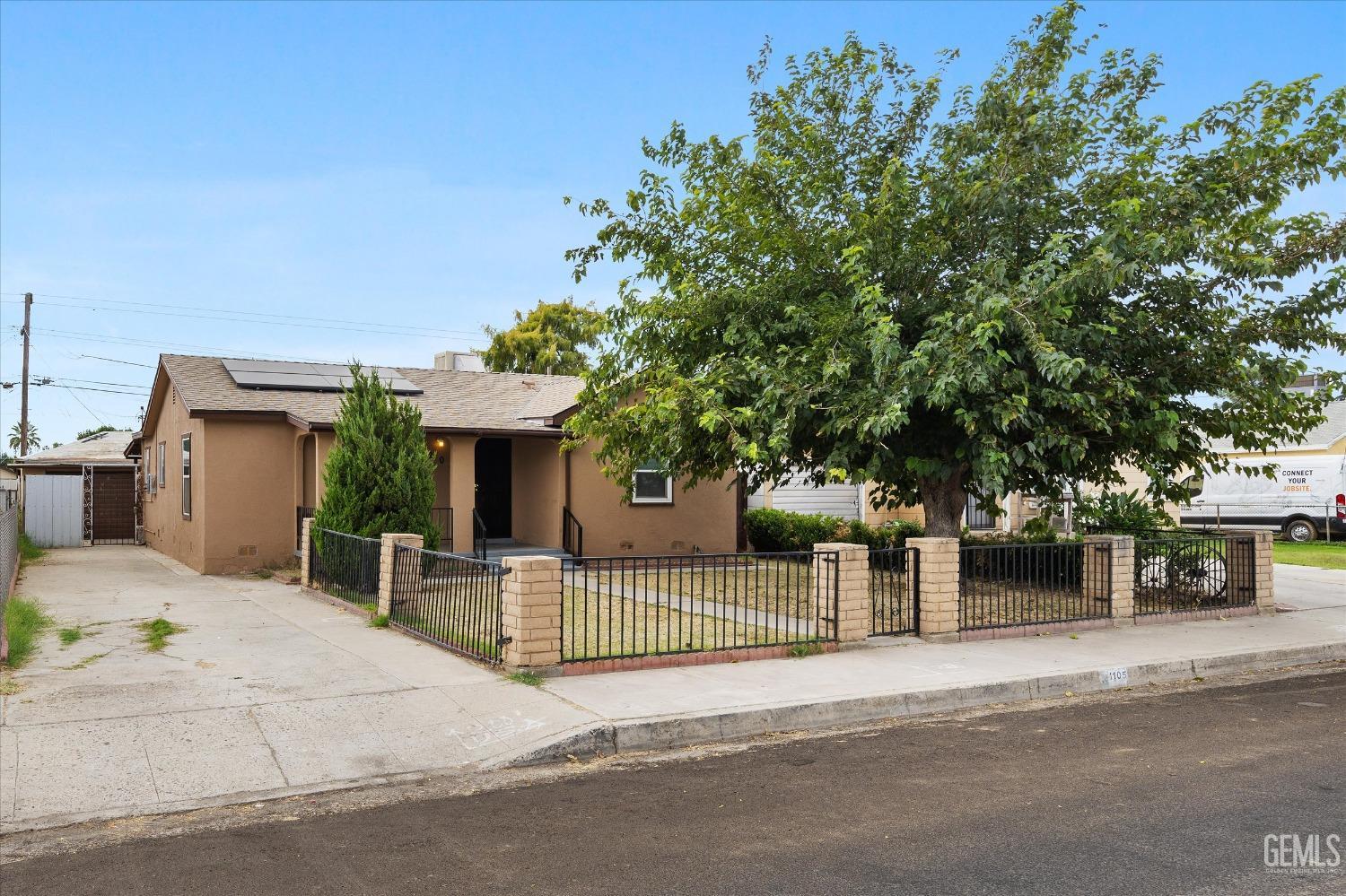 Undisclosed Address Bakersfield, CA 93308 - Photo 3 of 32 a house with trees in front of it