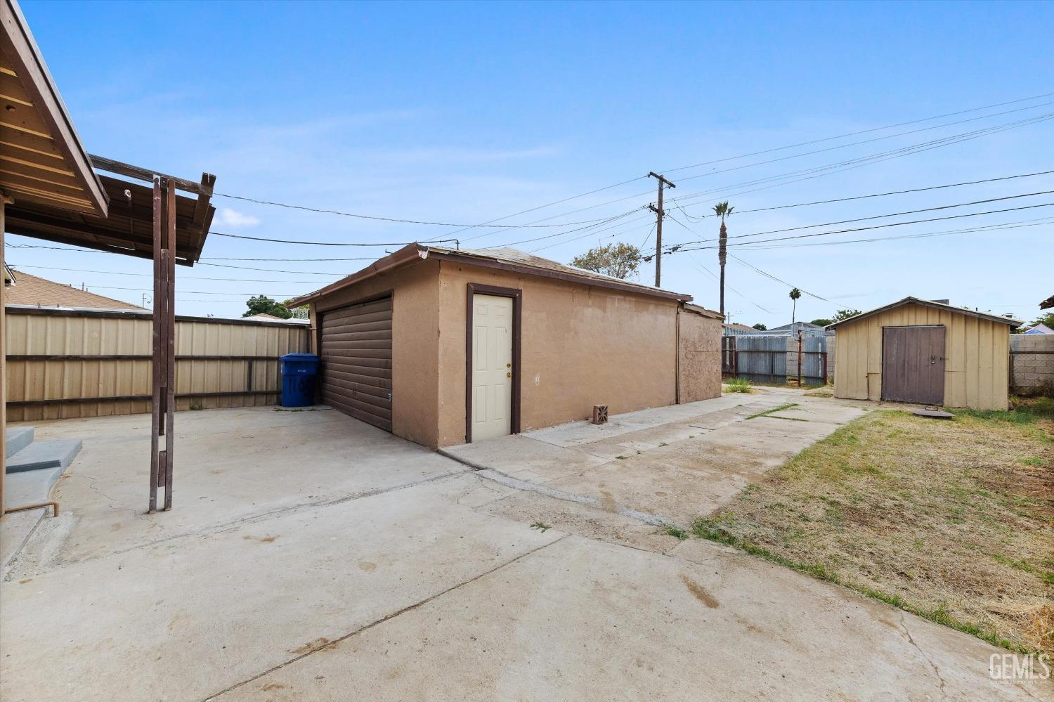 Undisclosed Address Bakersfield, CA 93308 - Photo 32 of 32 a front view of a house with garage