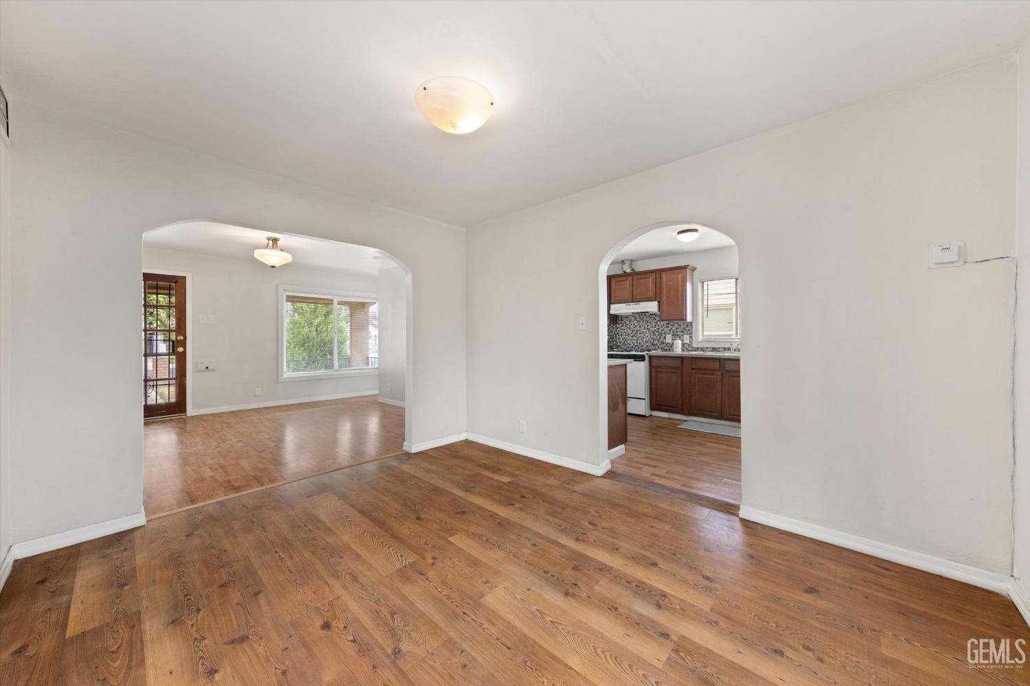 Undisclosed Address Bakersfield, CA 93308 - Photo 5 of 32 an empty room with windows and cabinet